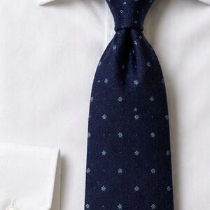Kiton Navy Tie with Light Blue Microdots Fashioned from Wool/Silk/Cashmere